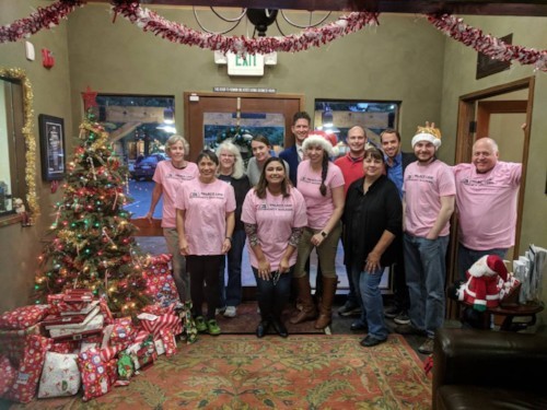 Palace Law Team in front of Christmas Tree